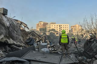 First responders search the rubble for victims at the site of an Israeli airstrike in the southern town of Nabatieh on May 9, 2026